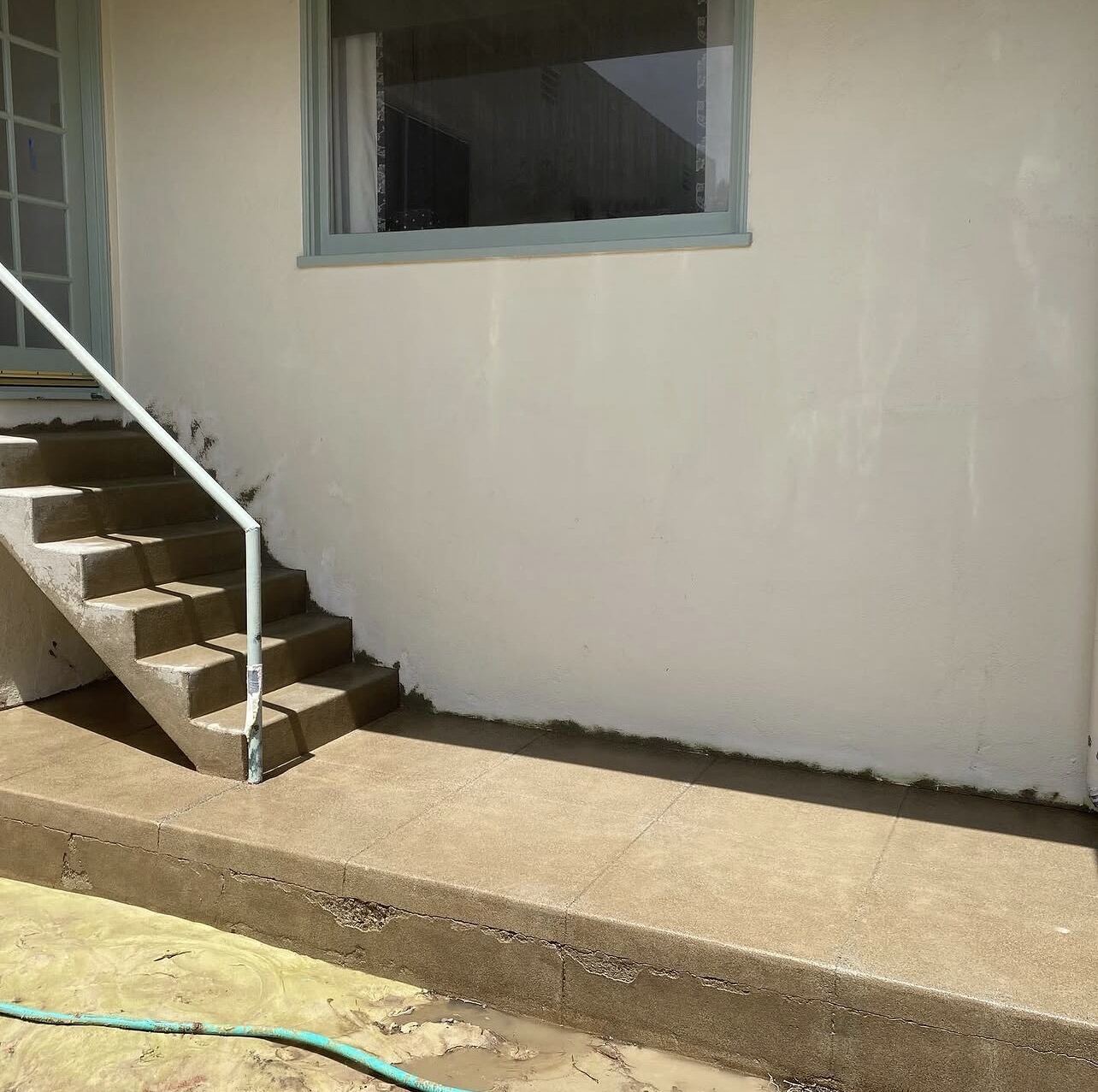 Same concrete steps and porch with the red paint removed