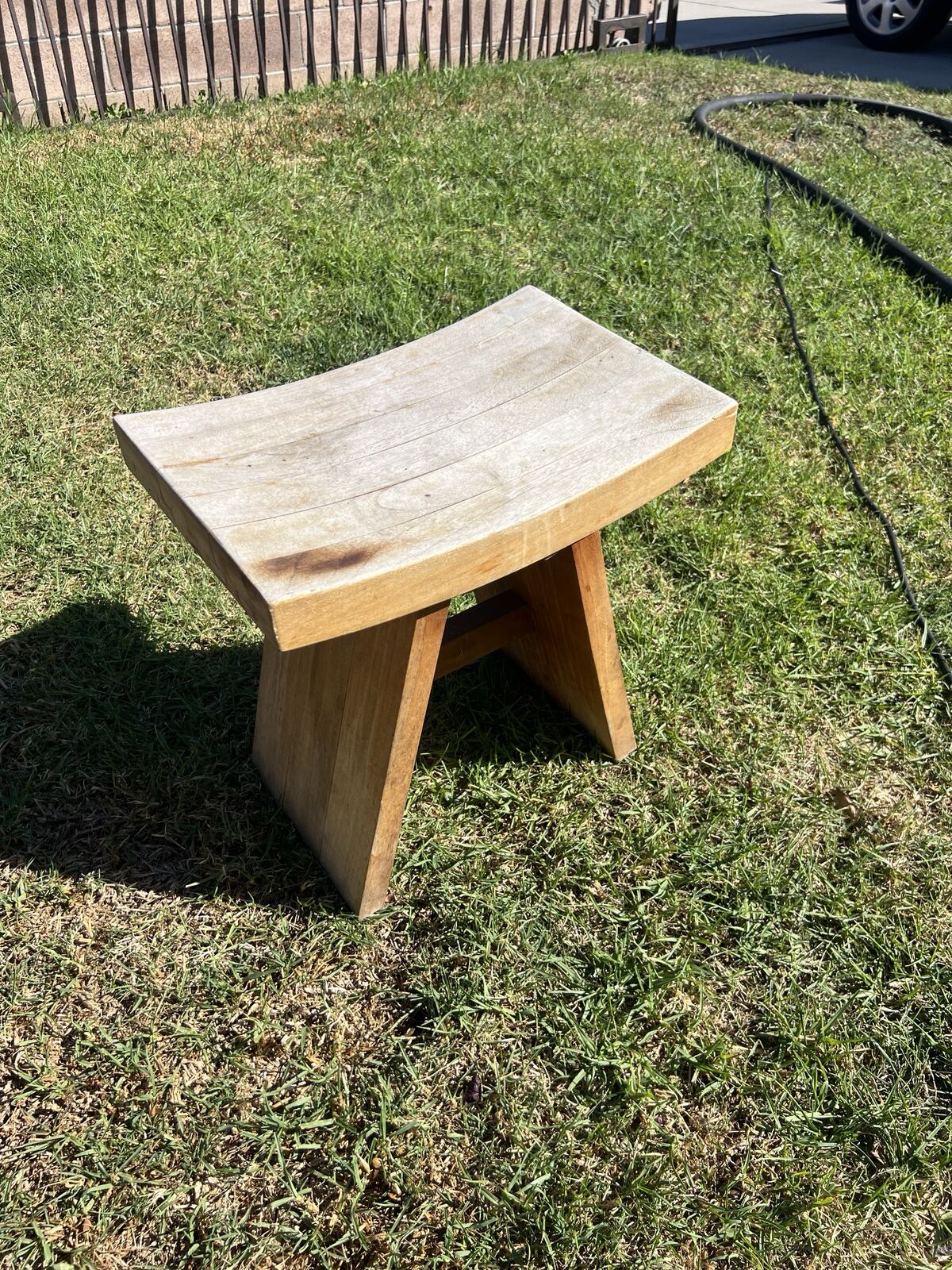 Weathered gray wooden stool before restoration