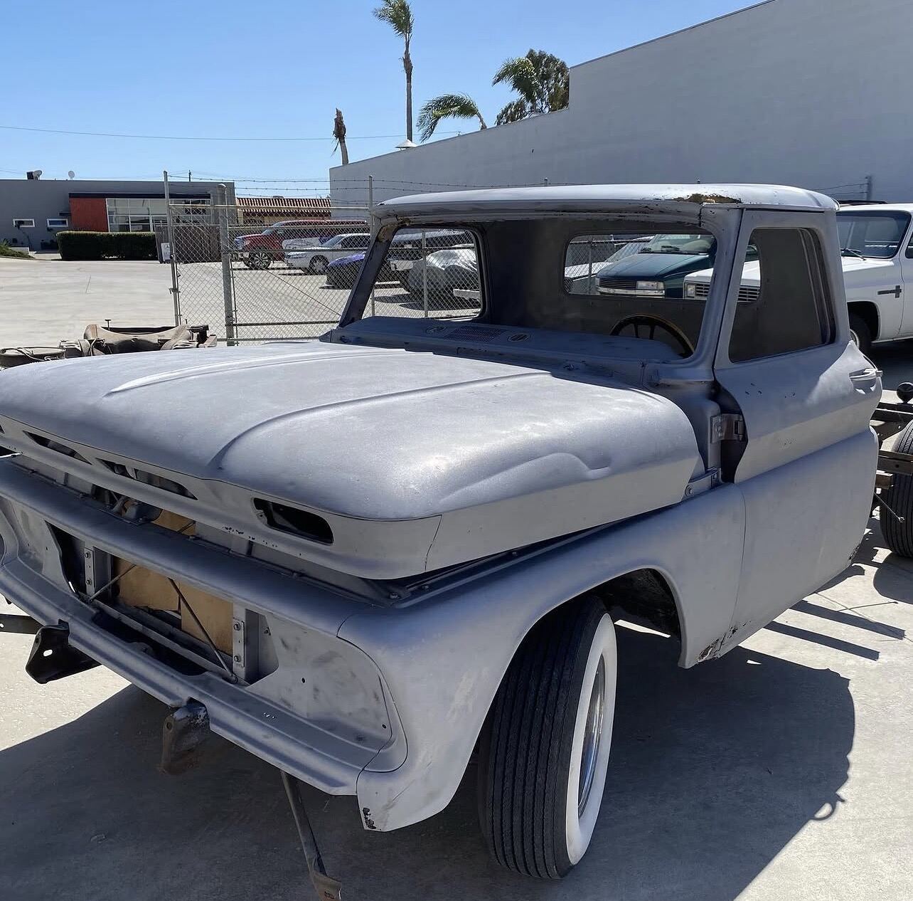 Same classic pickup stripped to bare metal after blasting